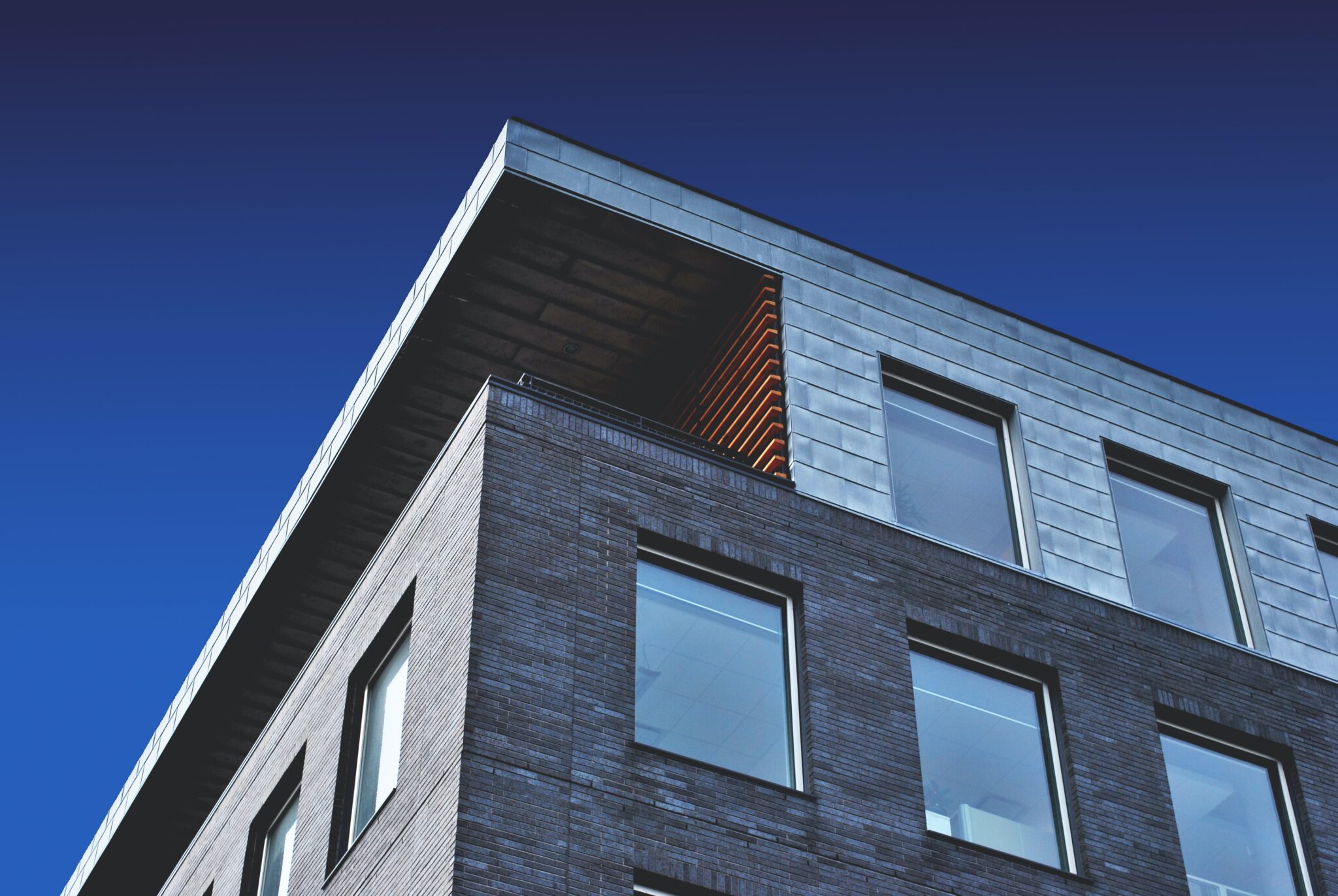 A building with windows and a sky background