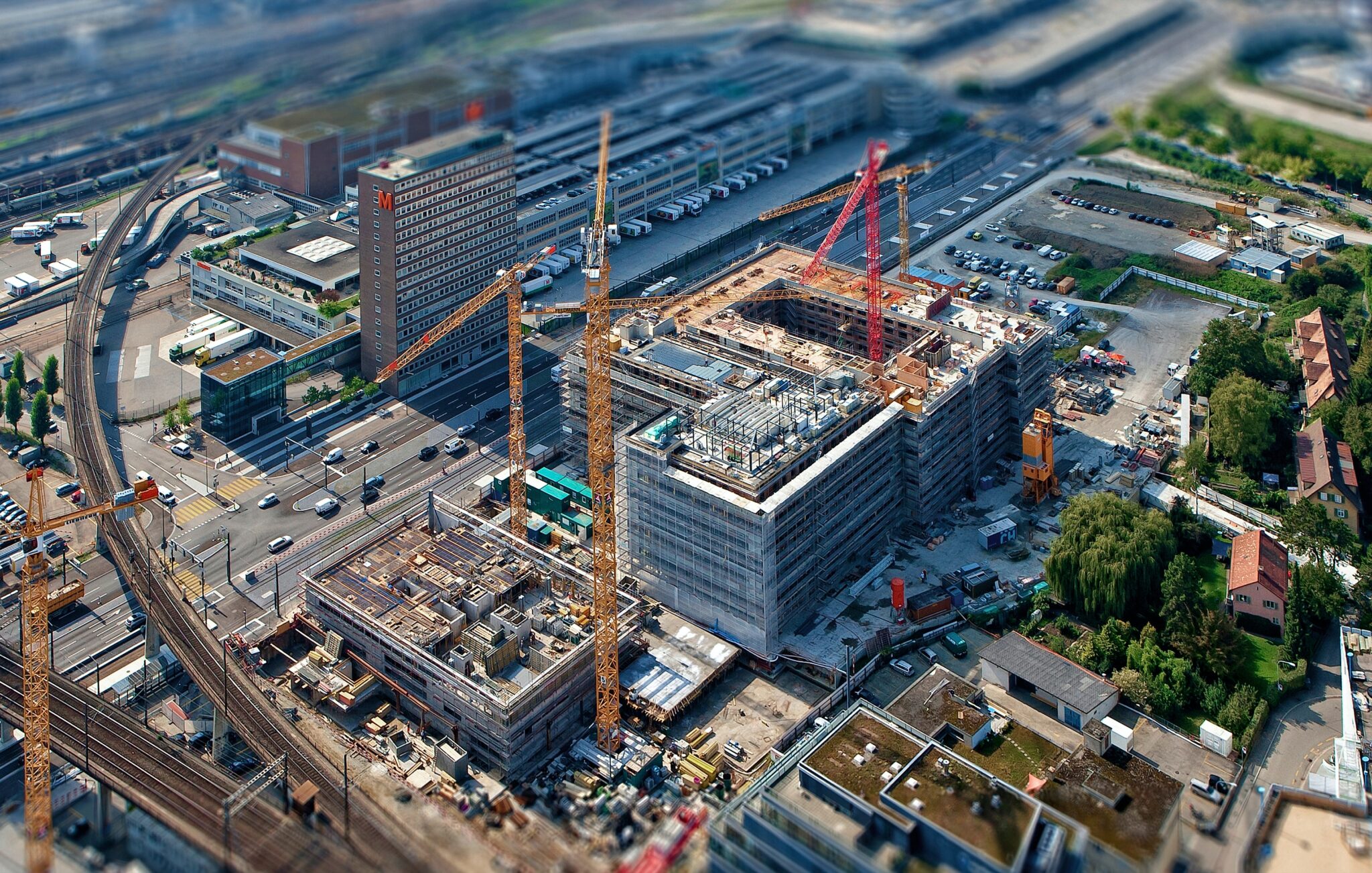 A view of an industrial area with construction equipment.